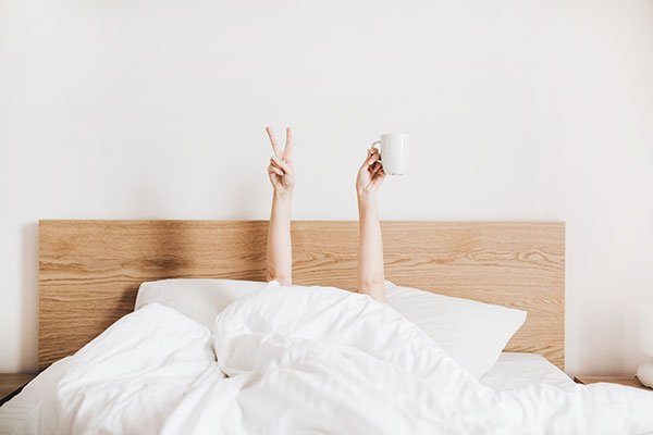 Person's Hands from Bed